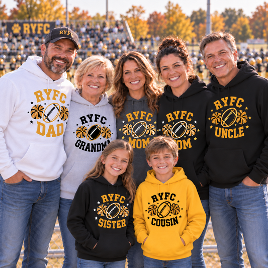 A family of seven wearing custom 'RYFC' themed hoodies and a t-shirt standing together on a football field. The group includes a grandfather, mother, father, mother, sister, cousin, and dad, all wearing matching apparel in white, gray, black, and yellow.